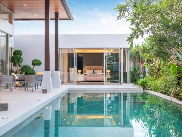 home-or-house-exterior-design-showing-tropical-pool-villa-with-green-garden_t20_Yww1LW