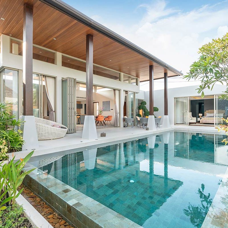 home-or-house-exterior-design-showing-tropical-pool-villa-with-green-garden_t20_ZxxjAY